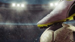 bola e chuteira representando marketing esportivo